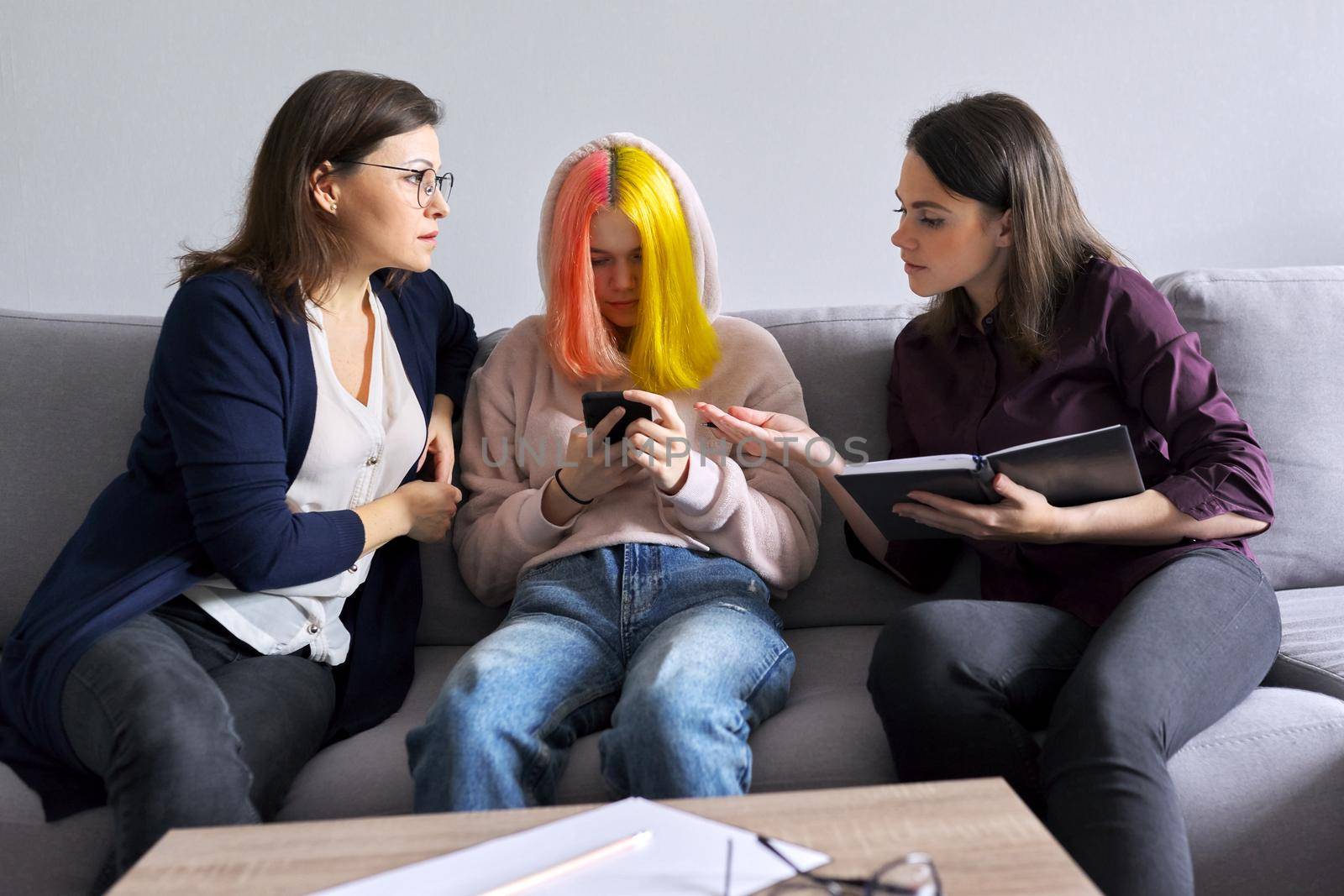 Mother and daughter teenager at consultation with psychologist, problems of adolescence by VH-studio