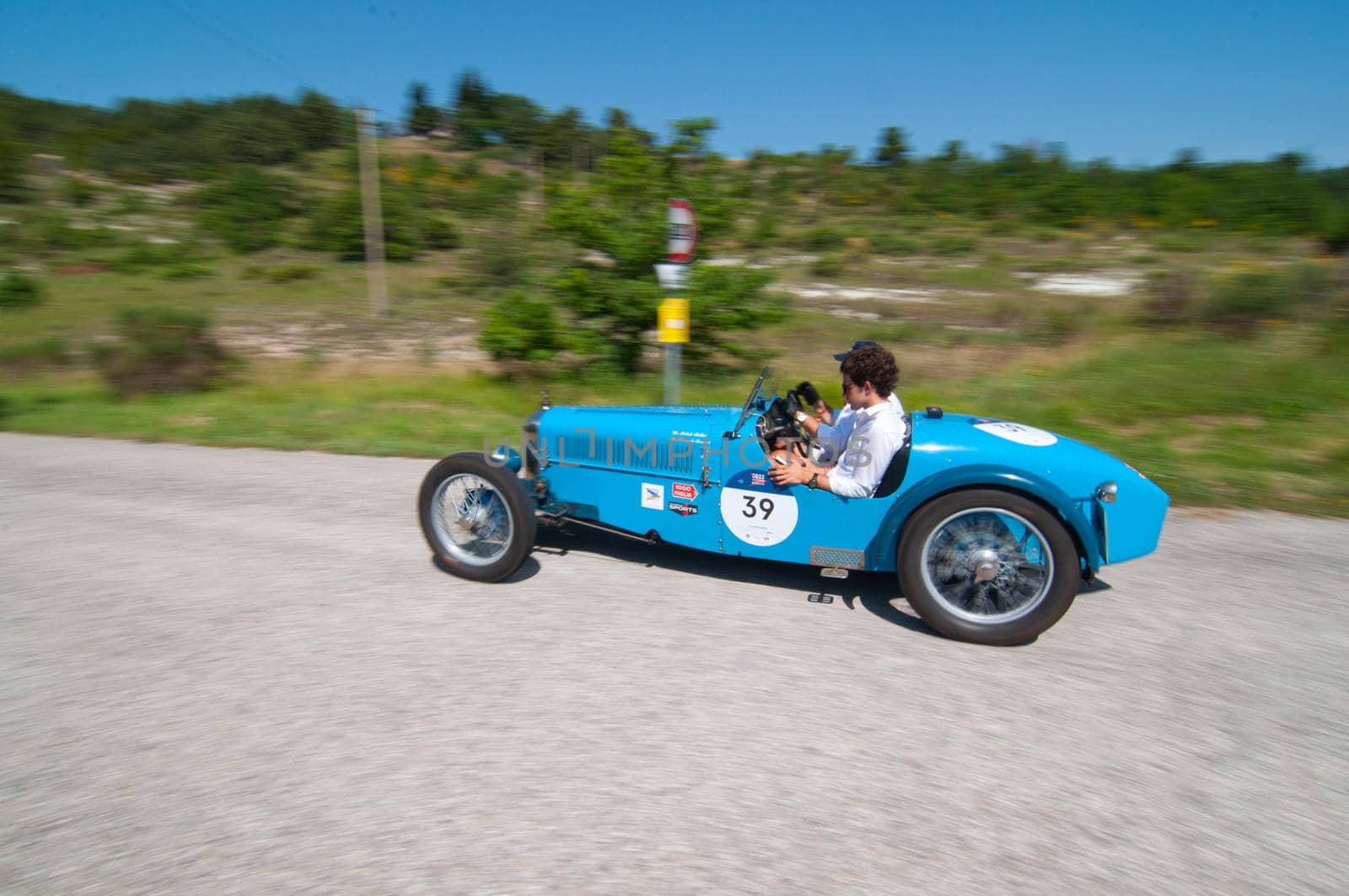 URBINO, ITALY - JUN 16 - 2022 : RALLY ABC 1100 1928 on an old racing car in rally Mille Miglia 2022 the famous italian historical race (1927-1957