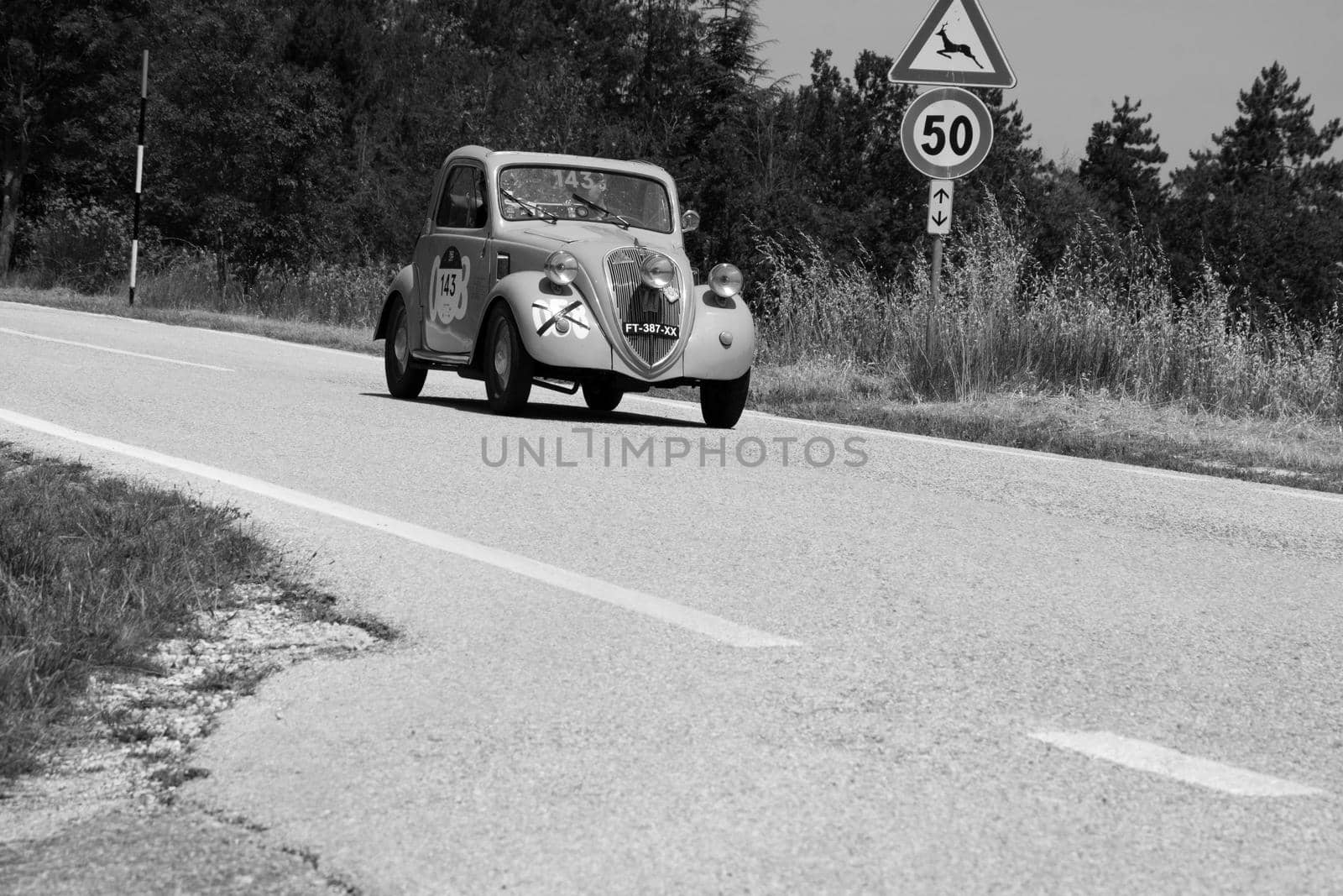 URBINO, ITALY - JUN 16 - 2022 : FIAT 500 B TOPOLINO 1948 on an old racing car in rally Mille Miglia 2022 the famous italian historical race (1927-1957