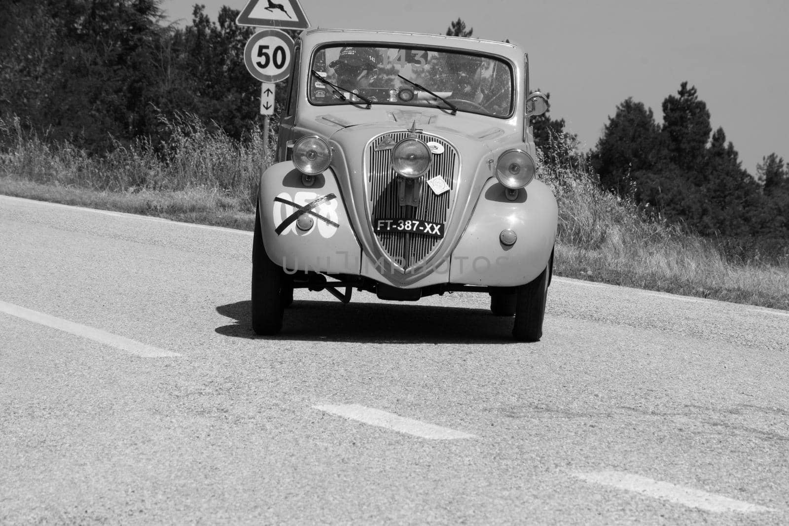 URBINO, ITALY - JUN 16 - 2022 : FIAT 500 B TOPOLINO 1948 on an old racing car in rally Mille Miglia 2022 the famous italian historical race (1927-1957