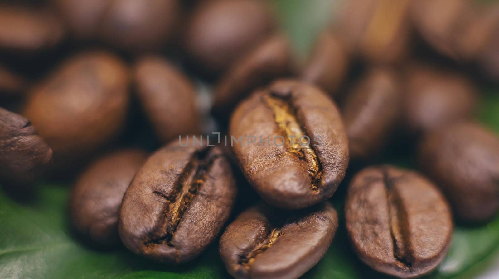 Coffee beans roasted close-up. Drink. Selective focus. by yanadjana