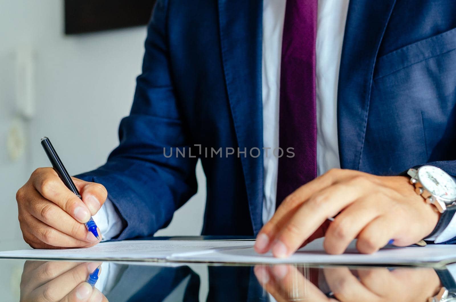Close up businessman signing contract making a deal, classic business. by Peruphotoart