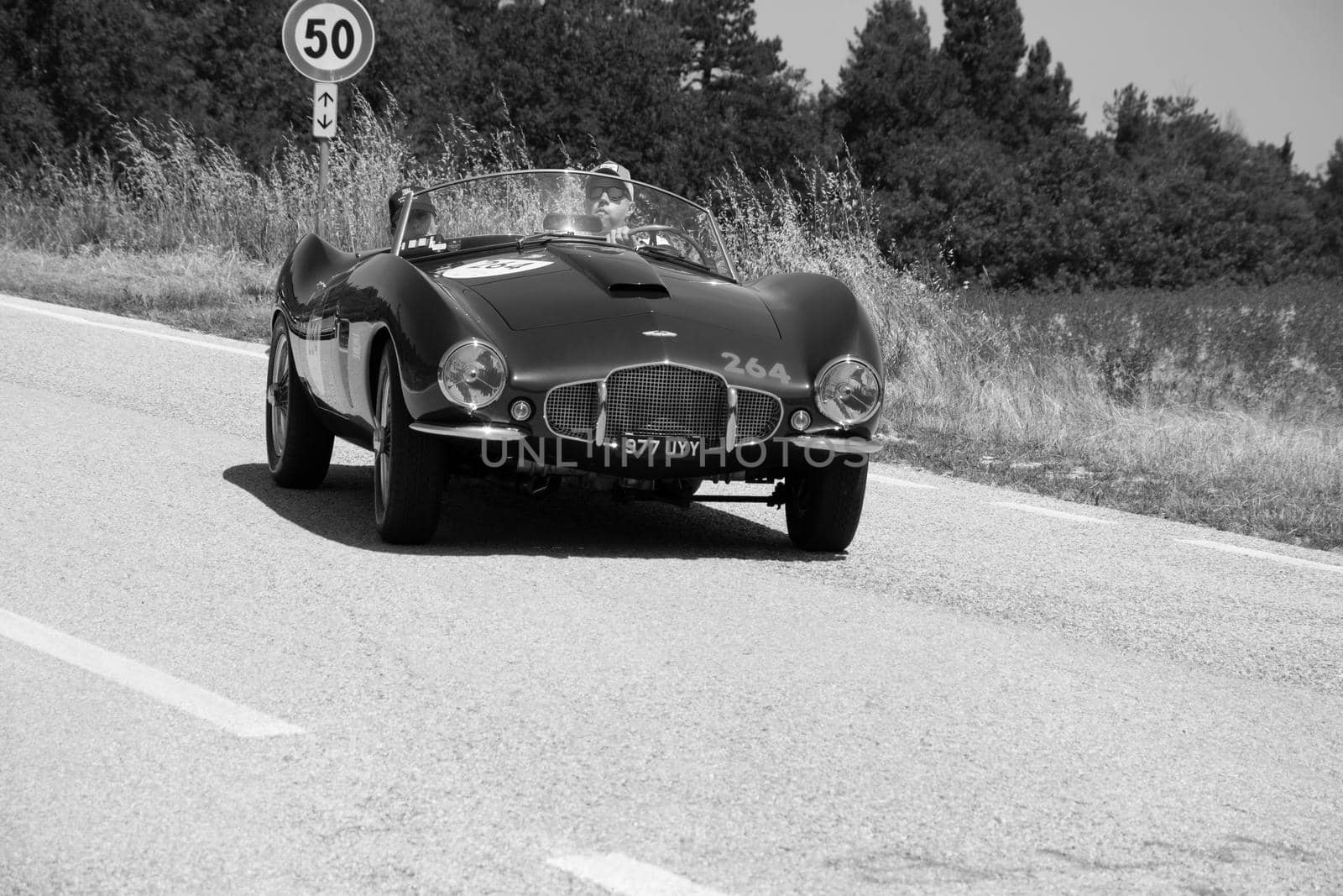 URBINO, ITALY - JUN 16 - 2022 : ASTON MARTIN DB 2/4 BERTONE SPIDER 1953 on an old racing car in rally Mille Miglia 2022 the famous italian historical race (1927-1957