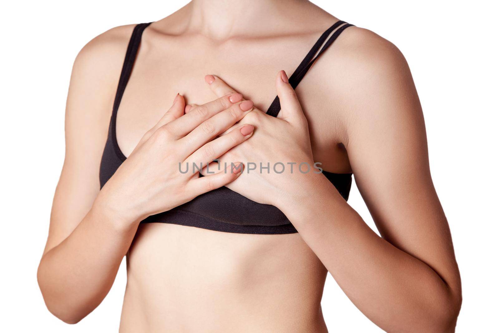 young woman with holding chest, pain on heart on white background.