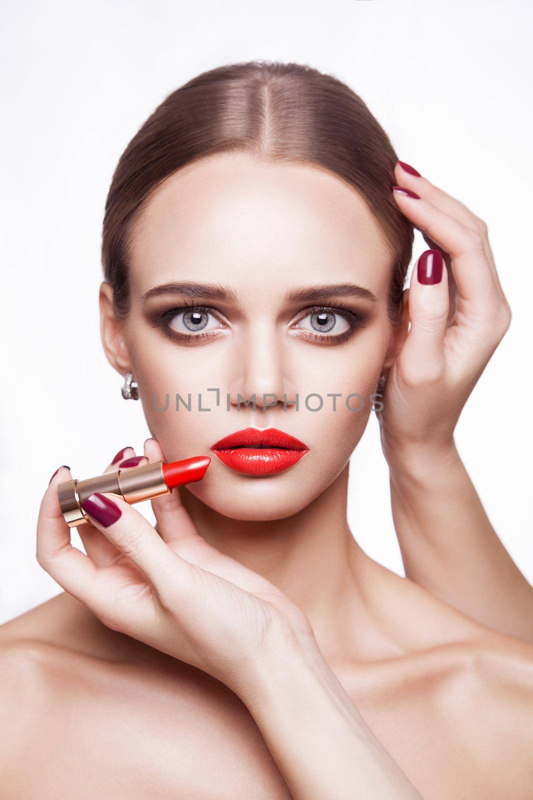 Closeup portrait of woman hand apply makeup on face. by Khosro1