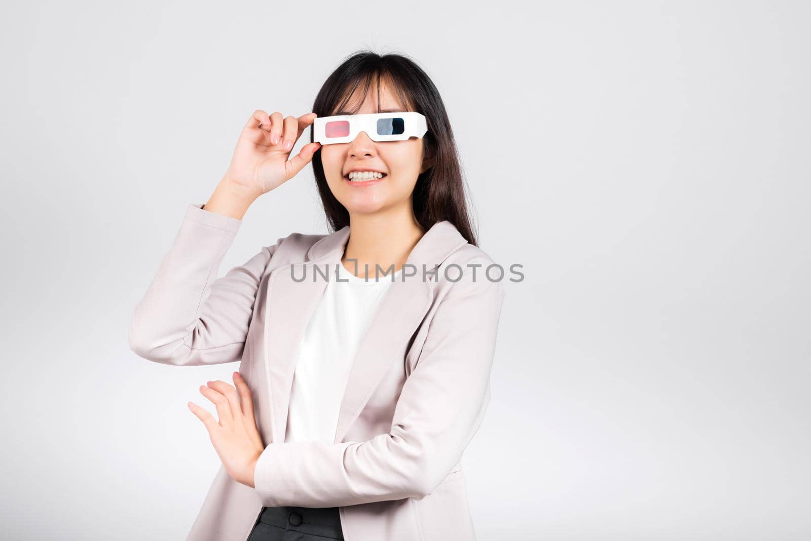 Smiling woman confidence wearing 3d cinema movie glasses by Sorapop