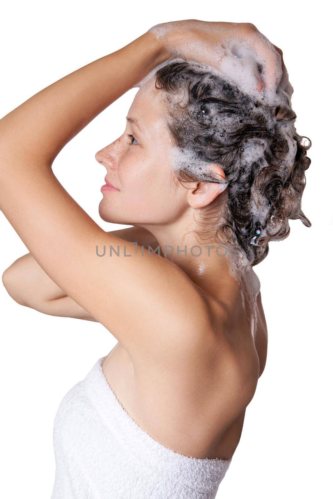 Beautiful woman taking a shower and shampooing her hair. washing hair with Shampoo. studio shot isolated on white background.