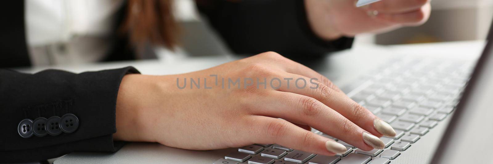 Close-up of woman press knobs on keyboard, pay online with credit card, remote shopping on laptop. Online shopping, technology, contactless payment concept