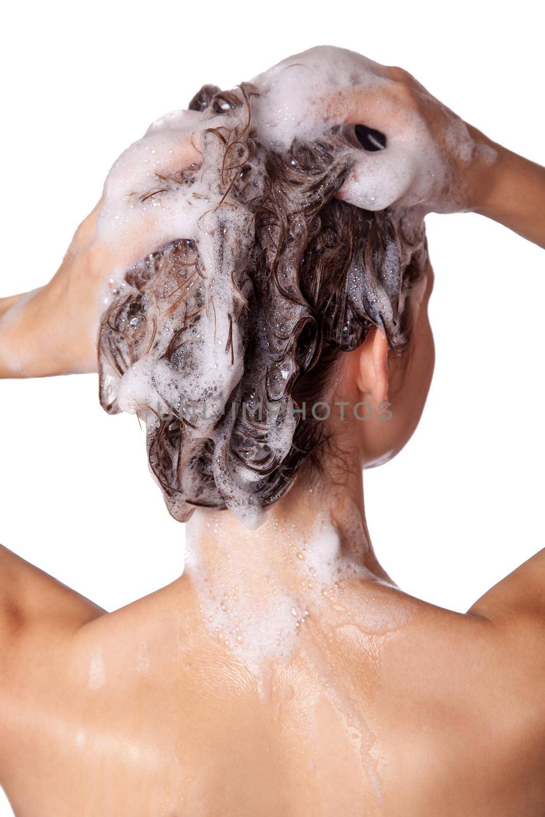Beautiful woman taking a shower and shampooing her hair. washing hair with Shampoo. studio shot isolated on white background.