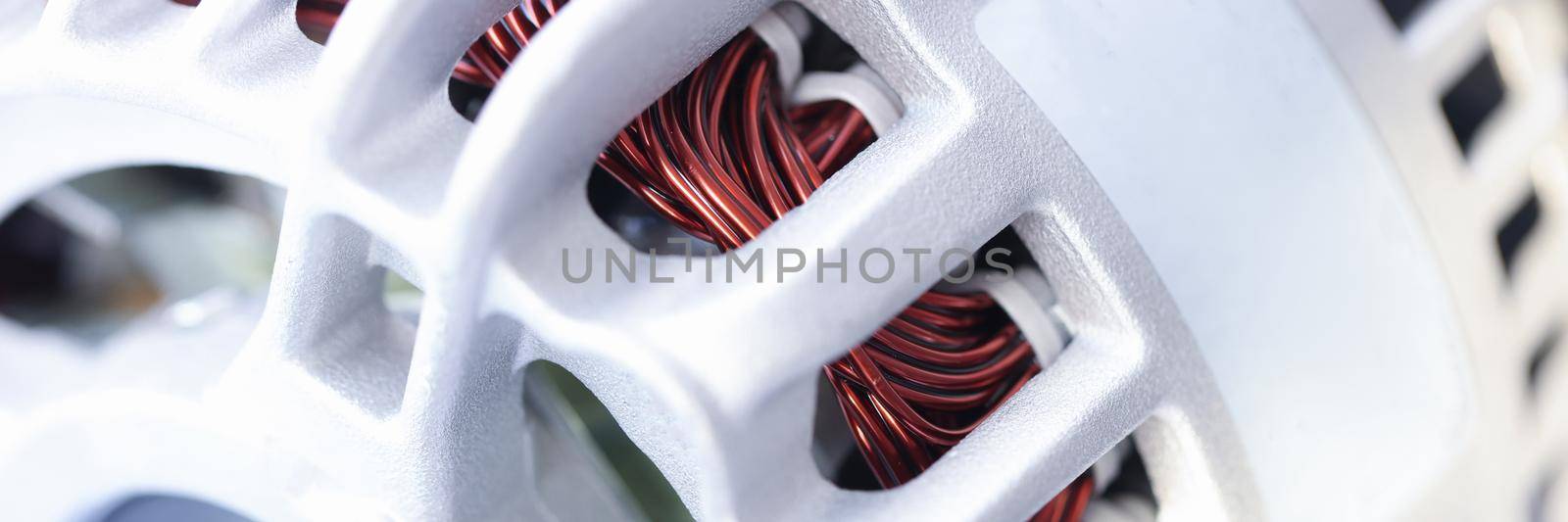 Closeup of white generator car repair parts. Auto repair and maintenance concept