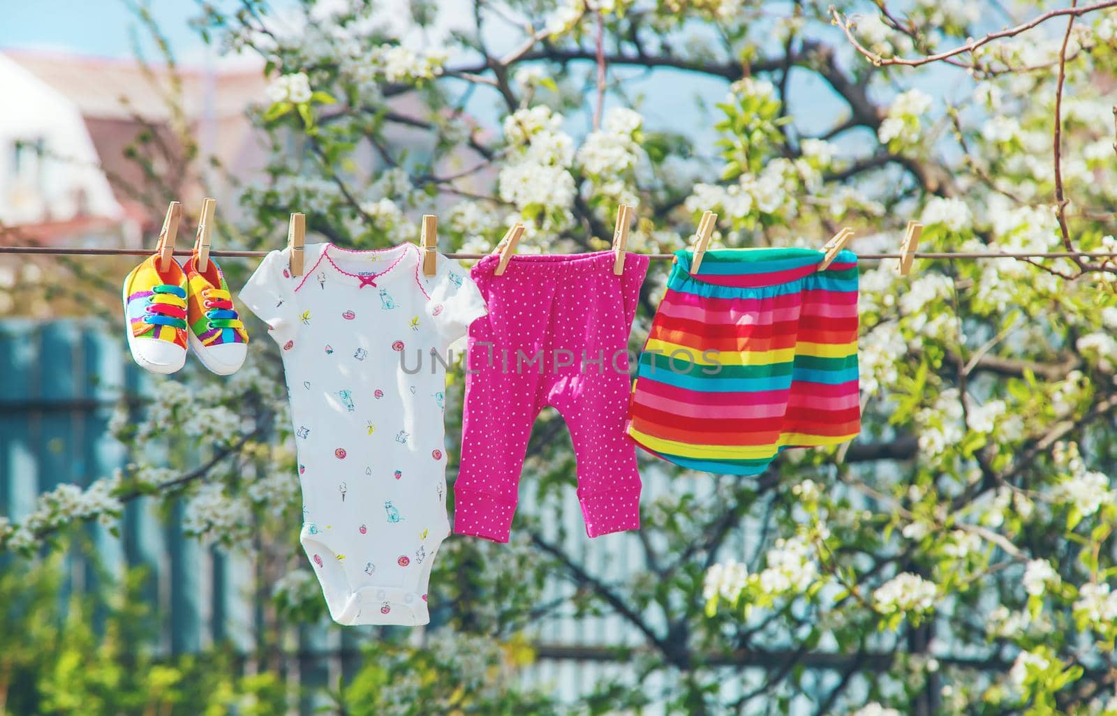 Baby clothes are drying on the street. Selective focus. nature.
