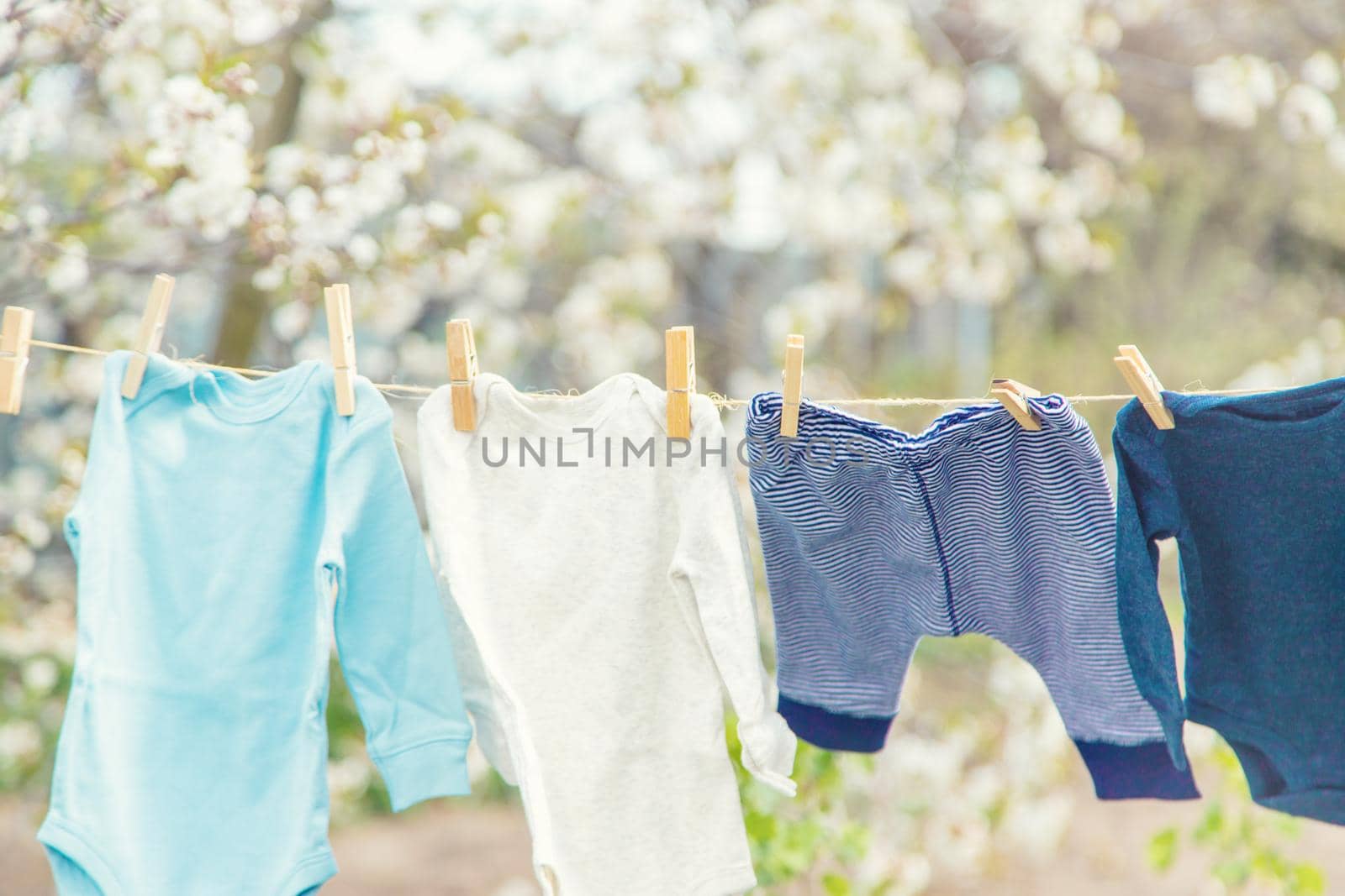 Baby clothes are drying on the street. Selective focus. nature.