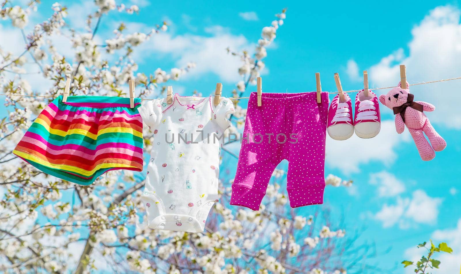 Baby clothes are drying on the street. Selective focus. nature.