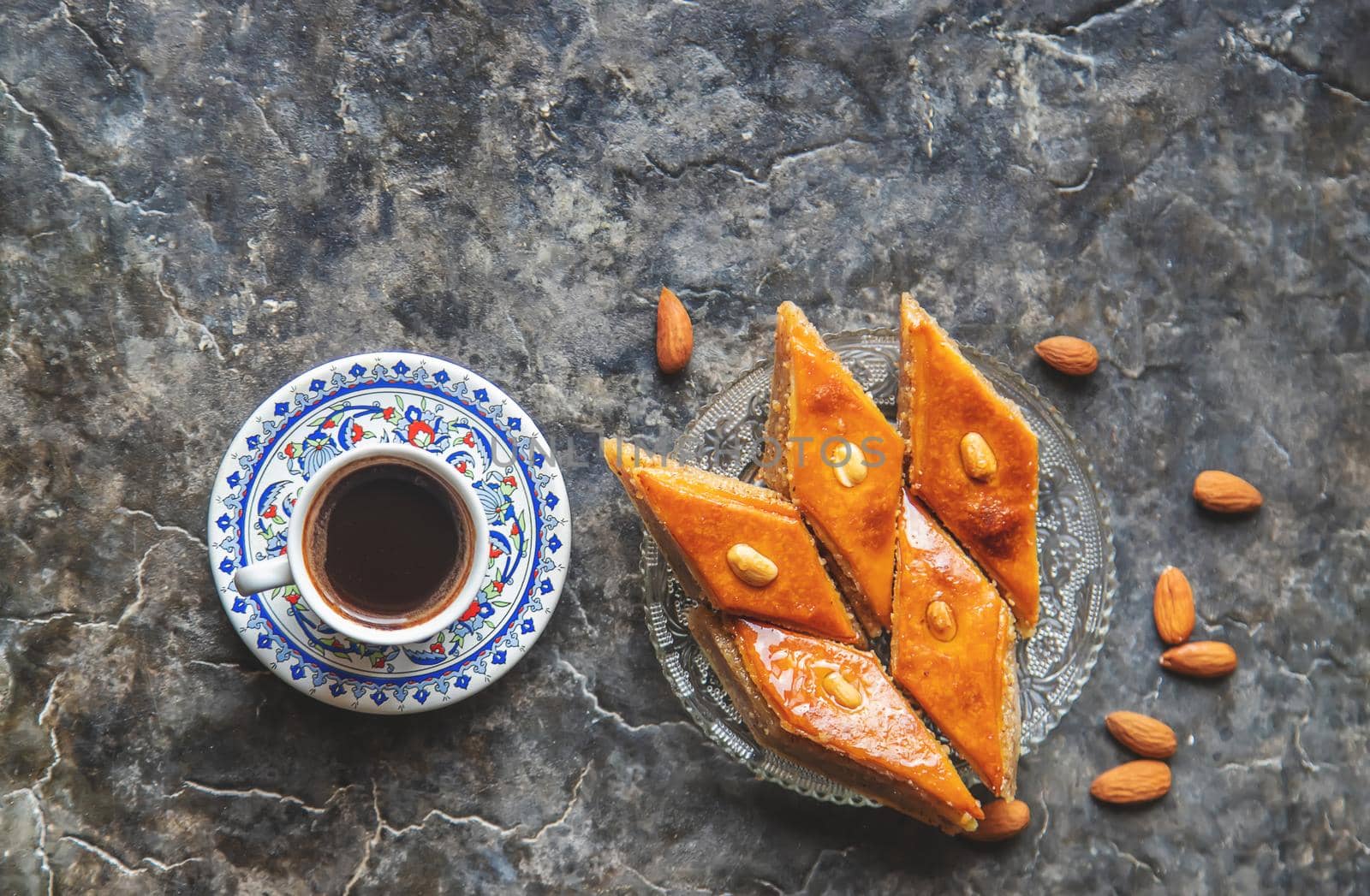 A cup of Turkish coffee and baklava. Selective focus. by yanadjana
