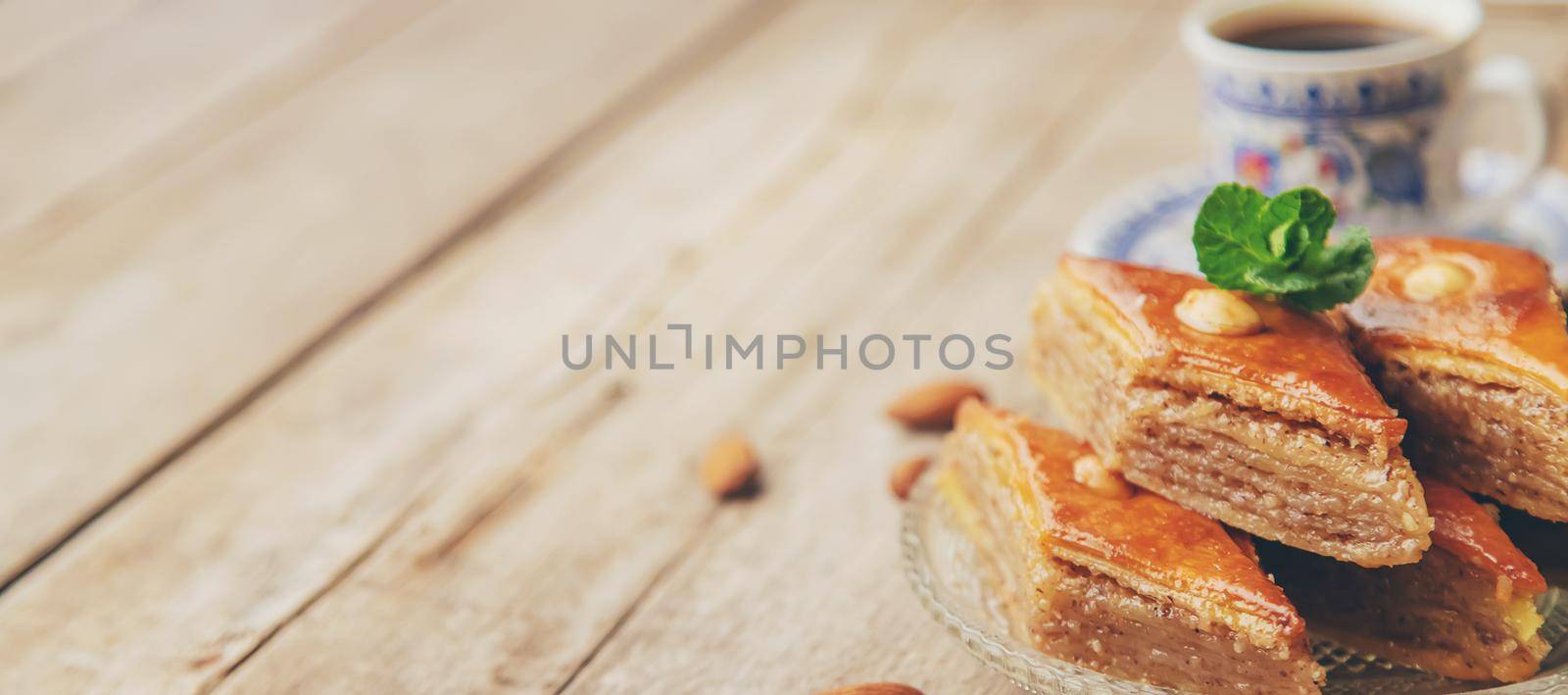 A cup of Turkish coffee and baklava. Selective focus. by yanadjana
