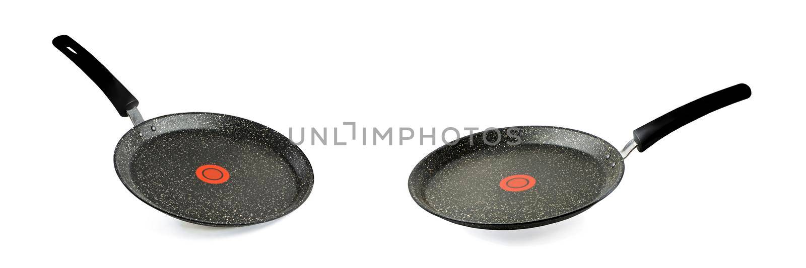 Black frying pan isolated on white background. Frying pan with non-stick coating and red temperature indicator. Isolate with shadow.