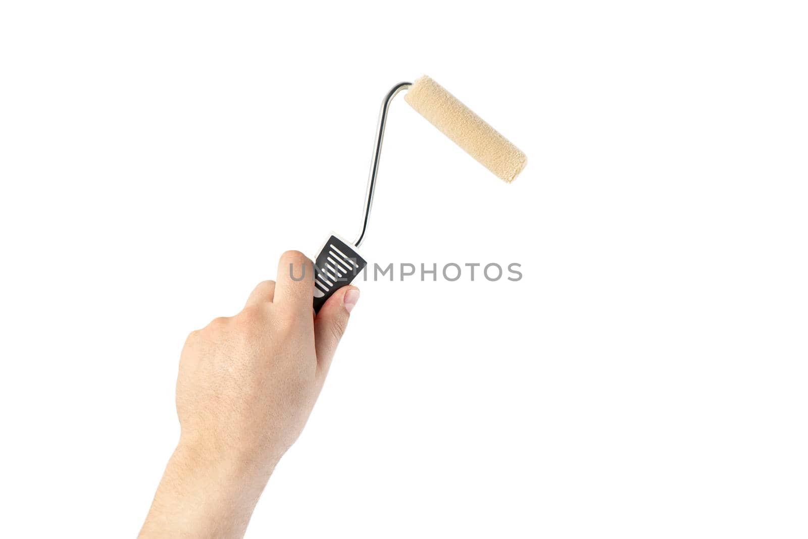 Paint roller in a man's hand. Renovation concept. Supplies and tools for painting walls isolated on white.