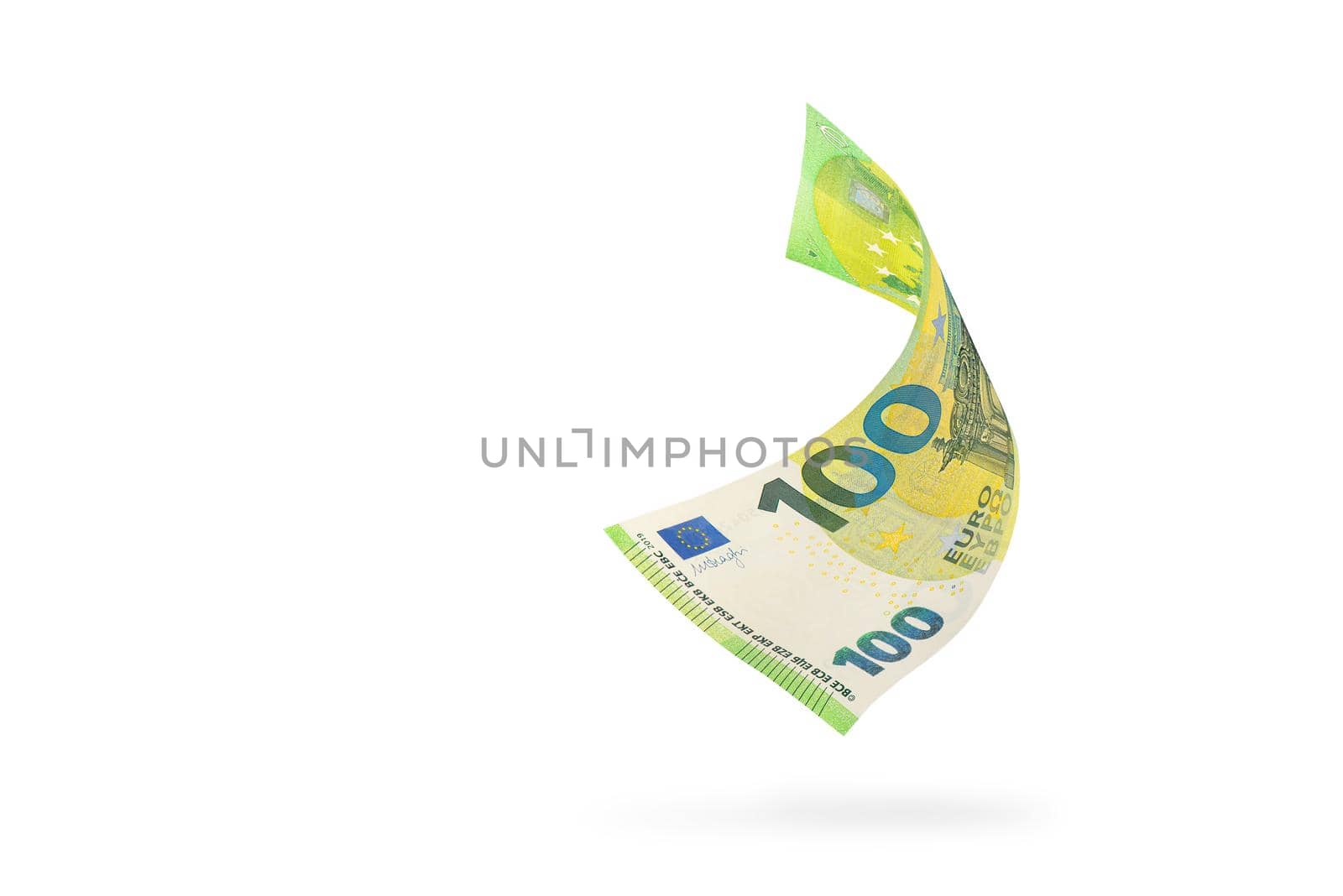 One hundred euro banknote isolated on white background. European money folded in half, close-up of money casts a shadow