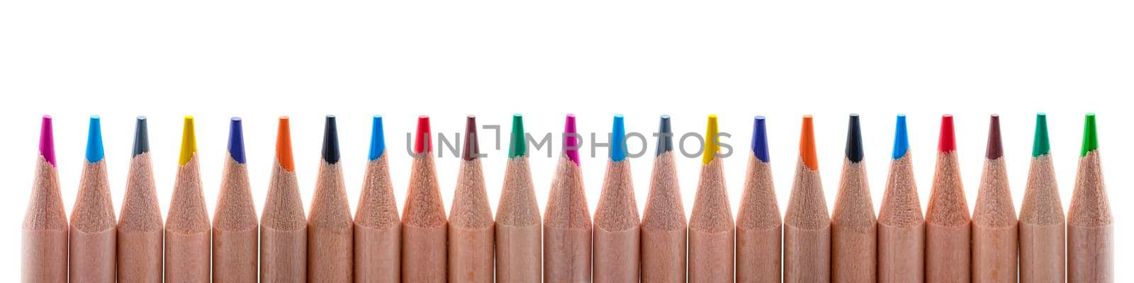 Isolate of multicolored wooden pencils. Pencils of different colors ,arranged in a rowstand out against a uniform white background, for insertion into a project or for printing a banner or label