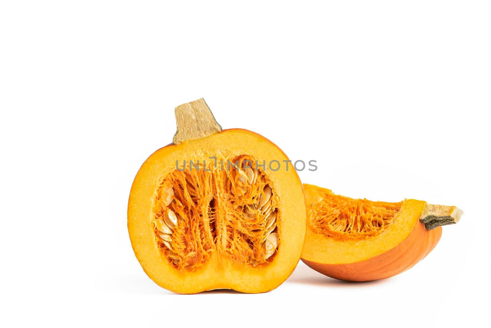 Pumpkin on a white background. Halloween theme. Sliced pumpkin on a white isolate. Highlight the pumpkin to insert into your project or design. Casts a shadow by SERSOL