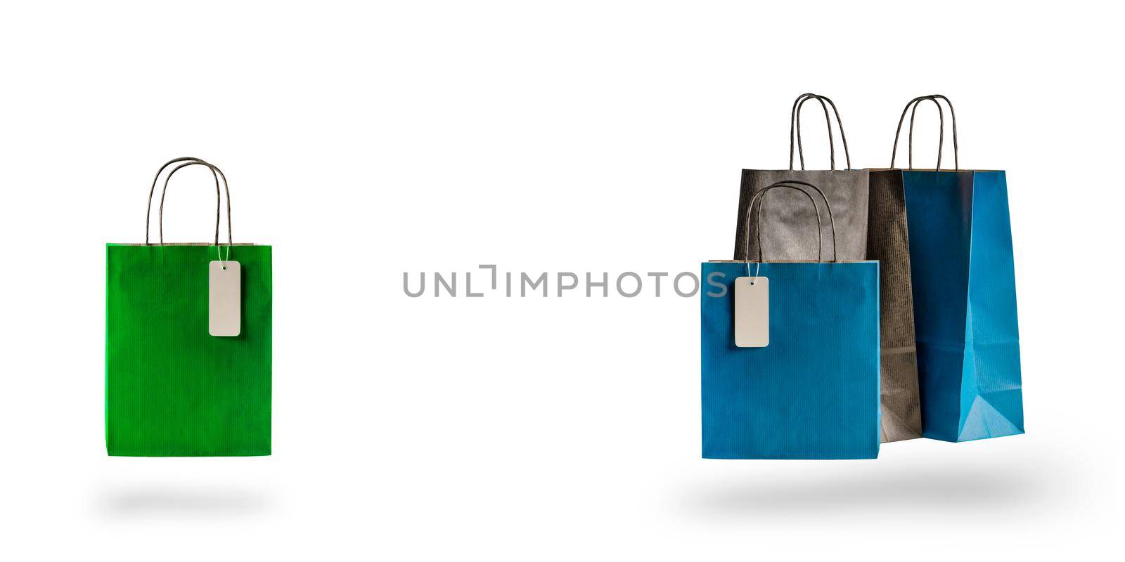 Set of multicolored shopping bags on a white isolated background. Sale and discounts 10, 20, 30, 40, 50. Packages float in the air, casting a shadow.