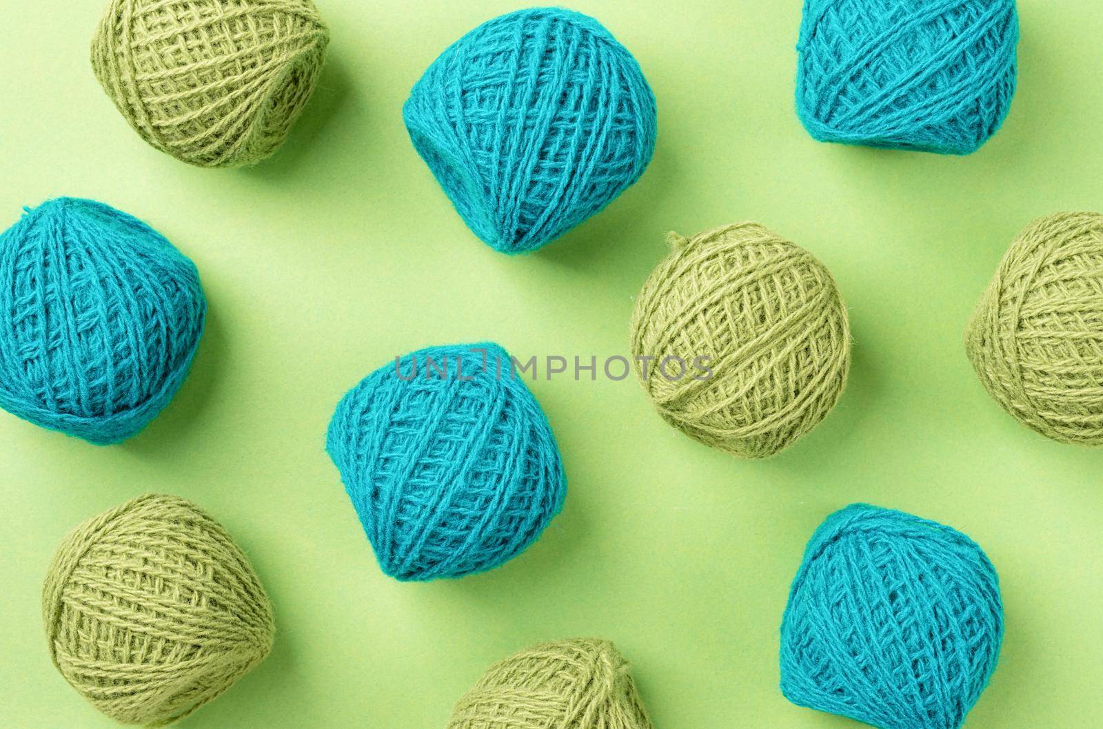 bright green yarn wool pattern on green background, top view flat lay