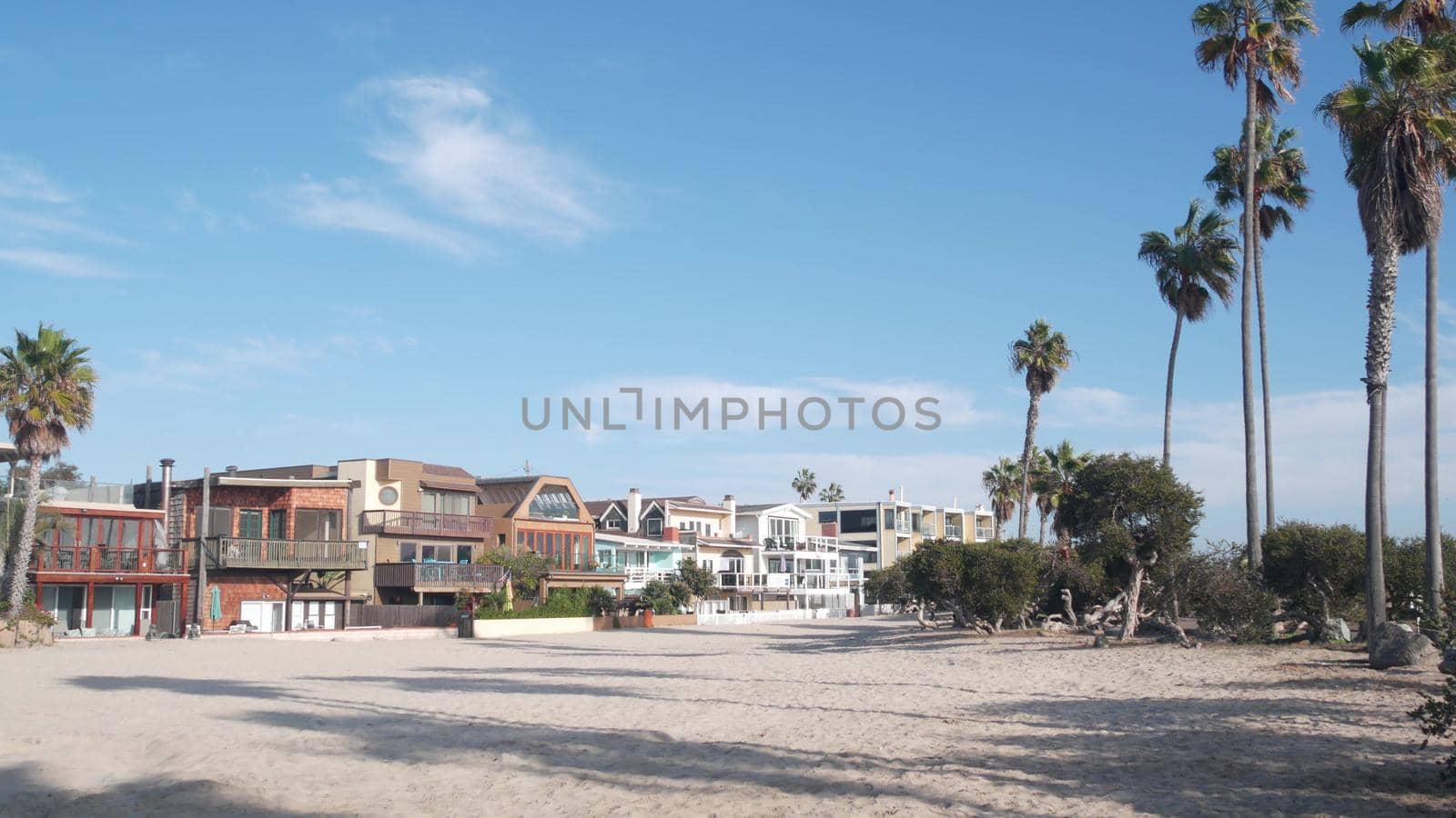 Beachfront vacation houses on waterfront walkway, ocean beach in California, USA by DogoraSun