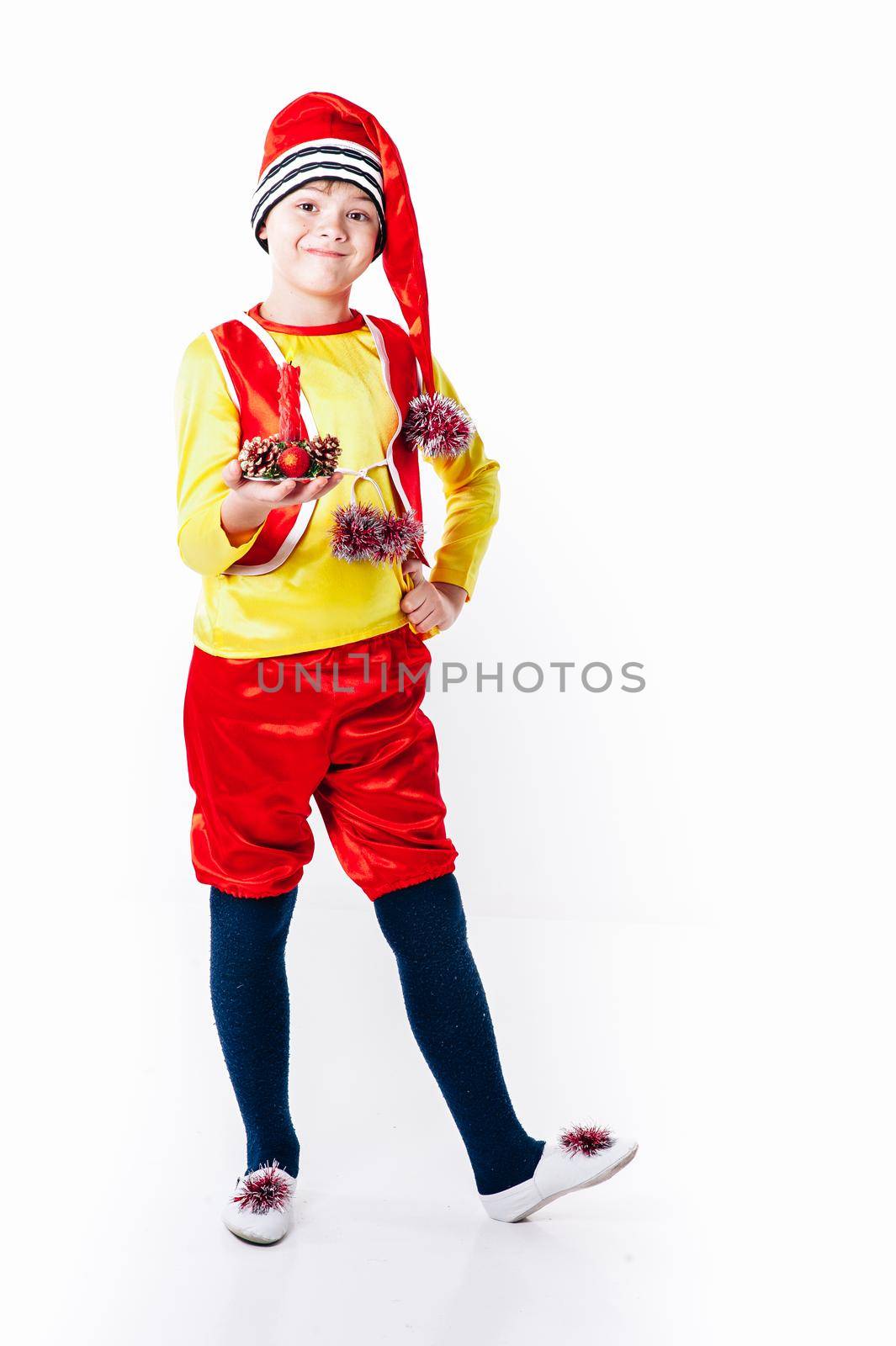 A baby dressed as a elf. isolated. Santa's helper. boy in suit of dwarf or elf by Andrii_Ko