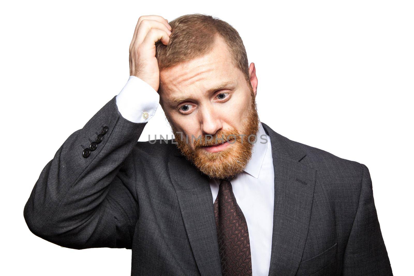 Unhappy sad businessman thinking with his hand on head. isolated on white, looking at camera..