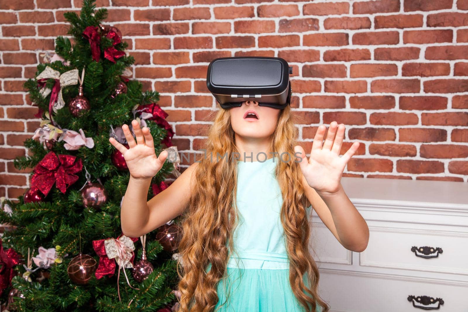 girl using virtual reality headset on new year holidays and enjoy.