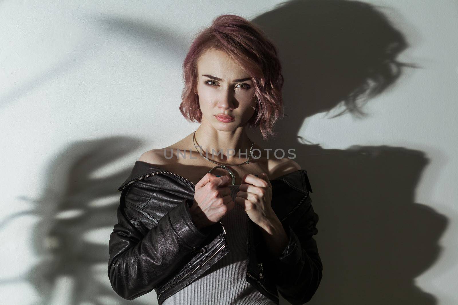 Female model posing near gray wall by Khosro1