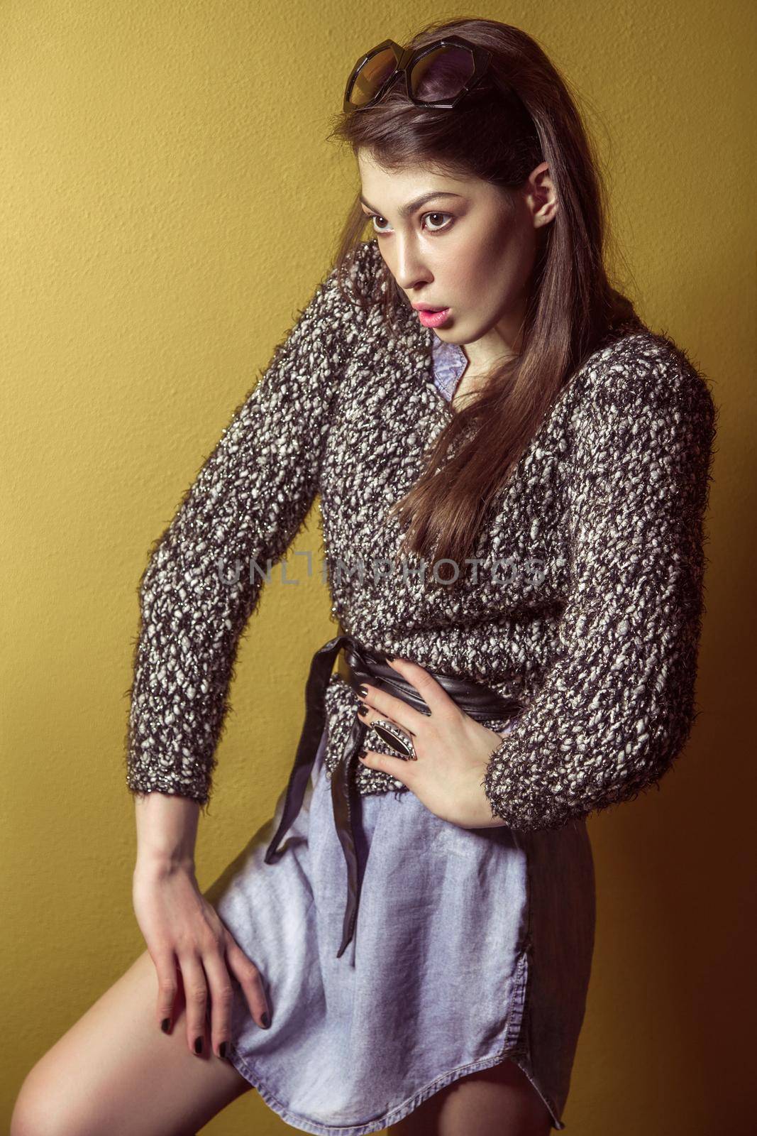 Mixed race sexy fashion model posing on stepladder. by Khosro1