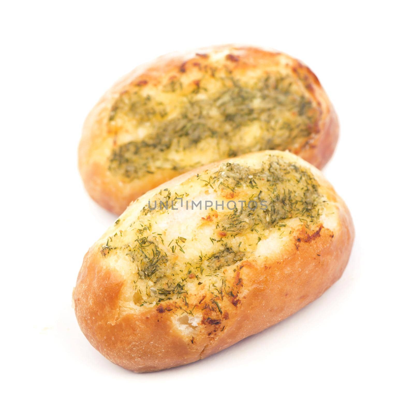 tasty bread with garlic lying on white background