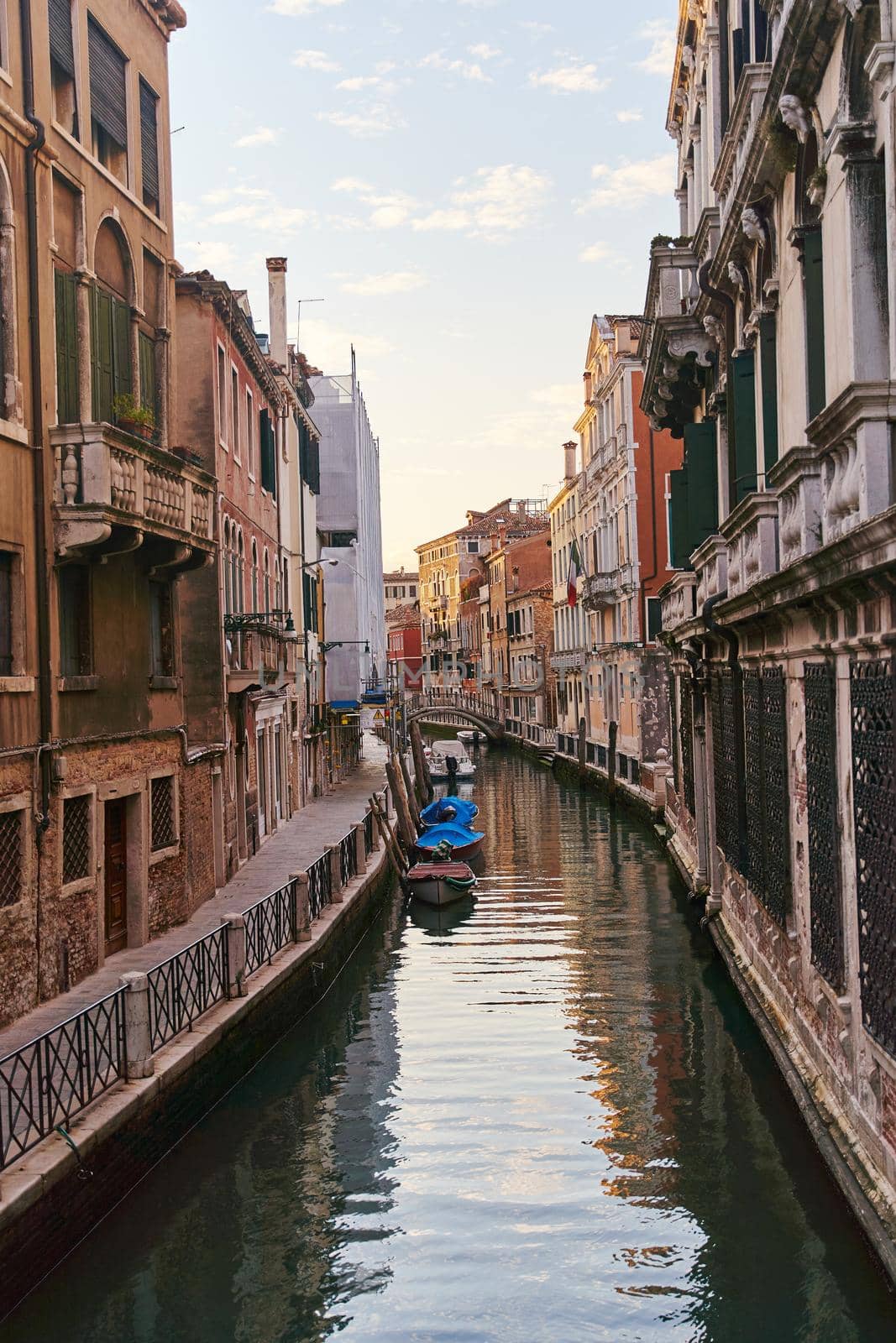 Venice, Italy - 10.12.2021: Traditional canal street with gondolas and boats in Venice, Italy. High quality photo