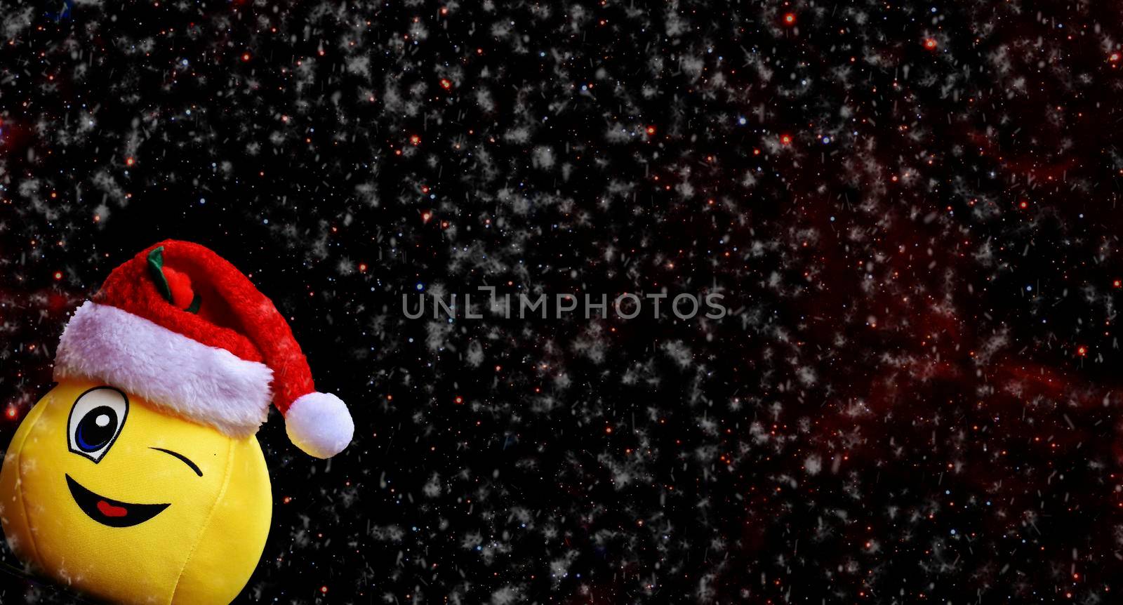 Background with a picture of a cheerful smiley in a red hat to create a holiday card
