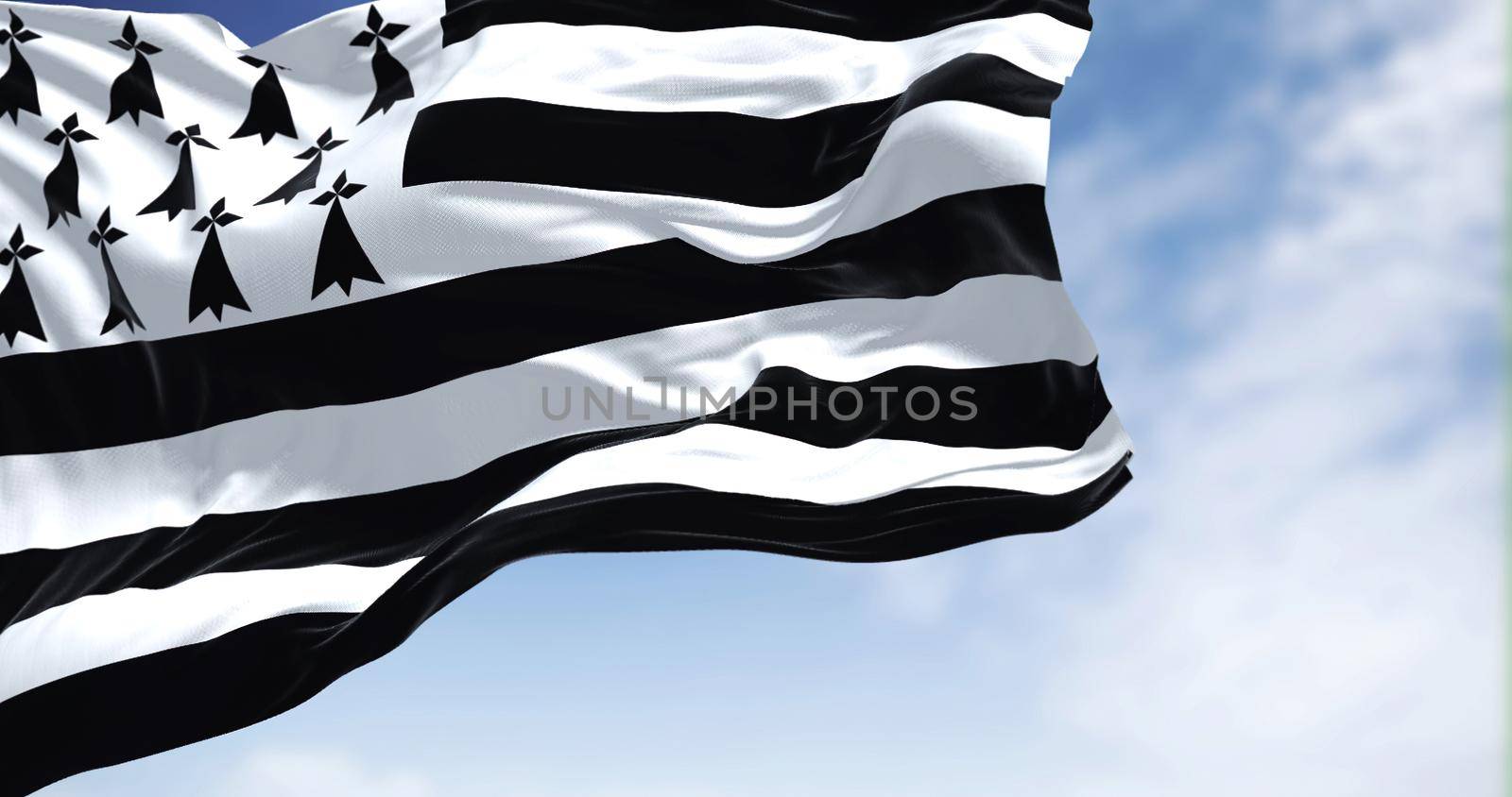 View of the Brittany flag waving in the wind on a clear day by rarrarorro