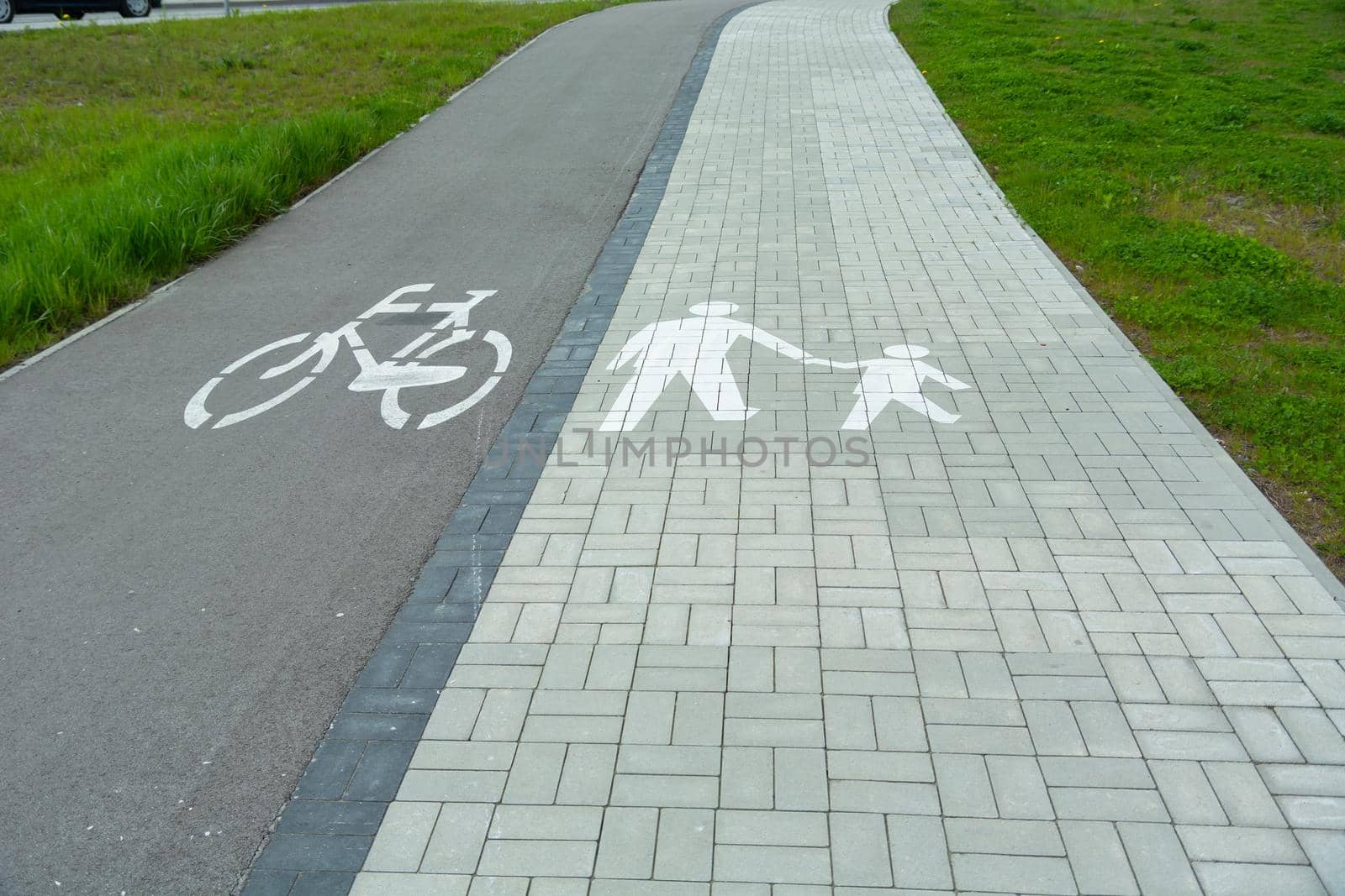 Path for pedestrian and bicycle traffic only and green grass