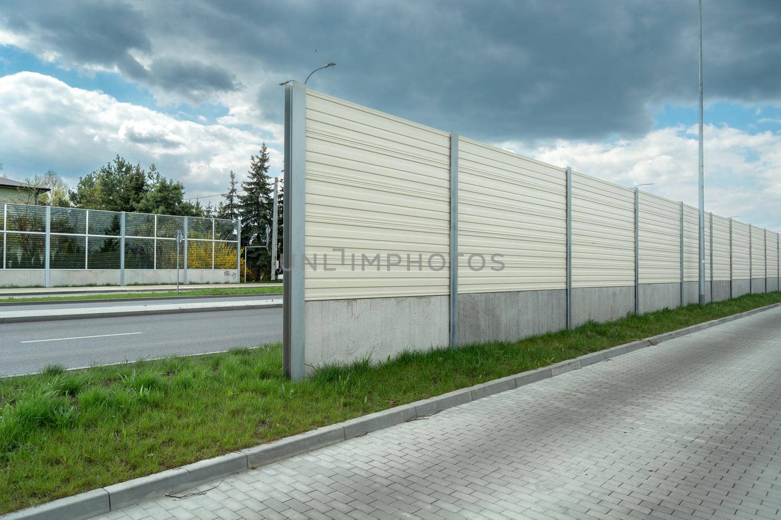 Noise barriers between two roads and cloudy sky, Chelm, Poland