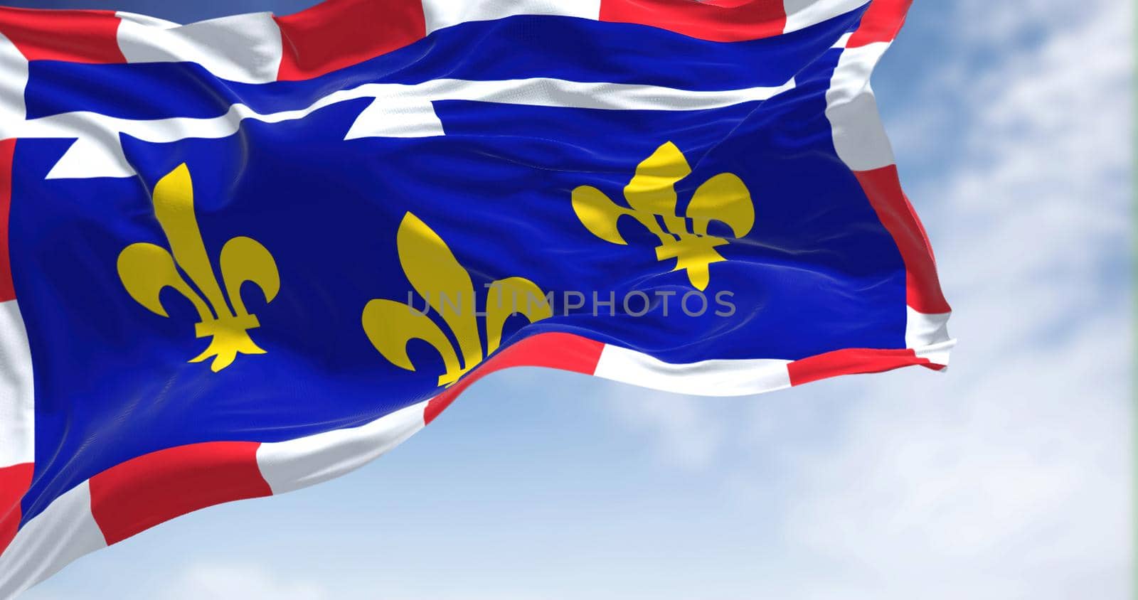 View of the Centre Val de Loire flag waving in the wind on a clear day. Centre-Val de Loire is one of the eighteen administrative regions of France. Selective focus.