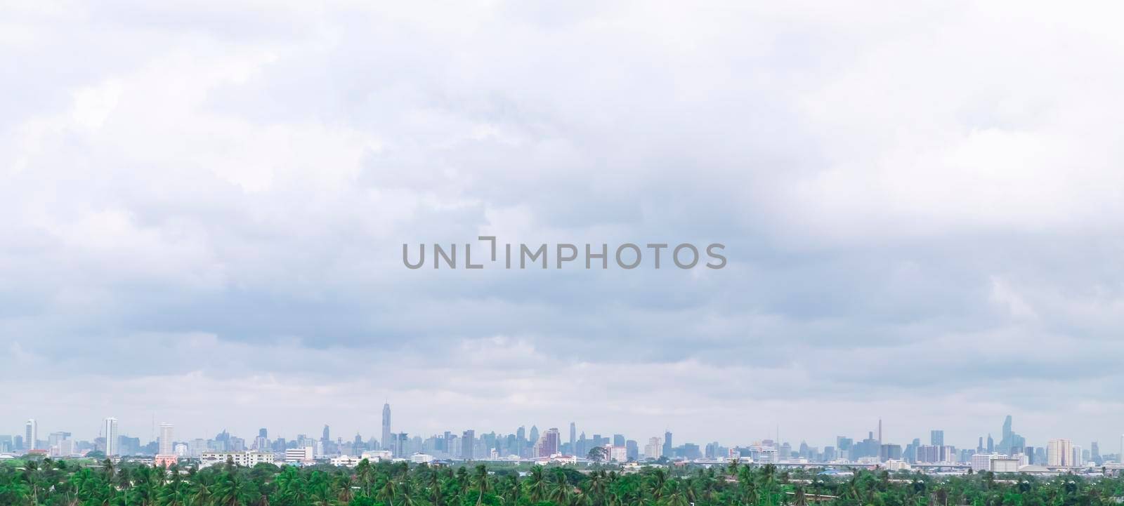 panoramic landscapes with green forest area or bufffer zone and Modern City Skyline.