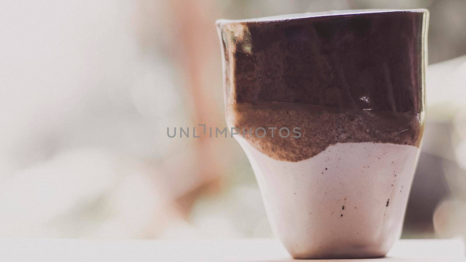 Empty ceramic cup handmade abstract art style on blurred nature background. You can cut photo Image drinks in the cup japan by Petrichor