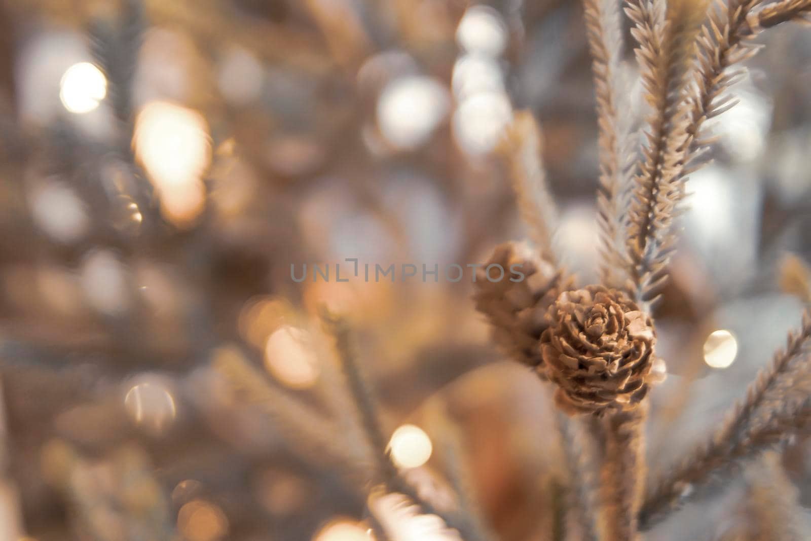 Gold Christmas background of de-focused lights with decorated tree. Decorated Christmas tree on blurred background. Happiness moment . New year background