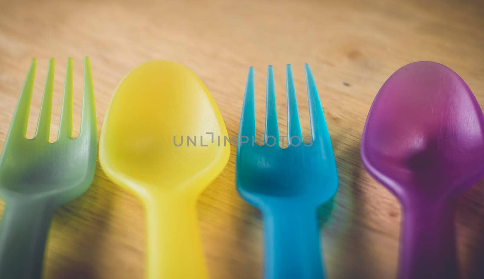 Multicolored plastic forks and spoons.environment concept idea . save earth .ban plastic