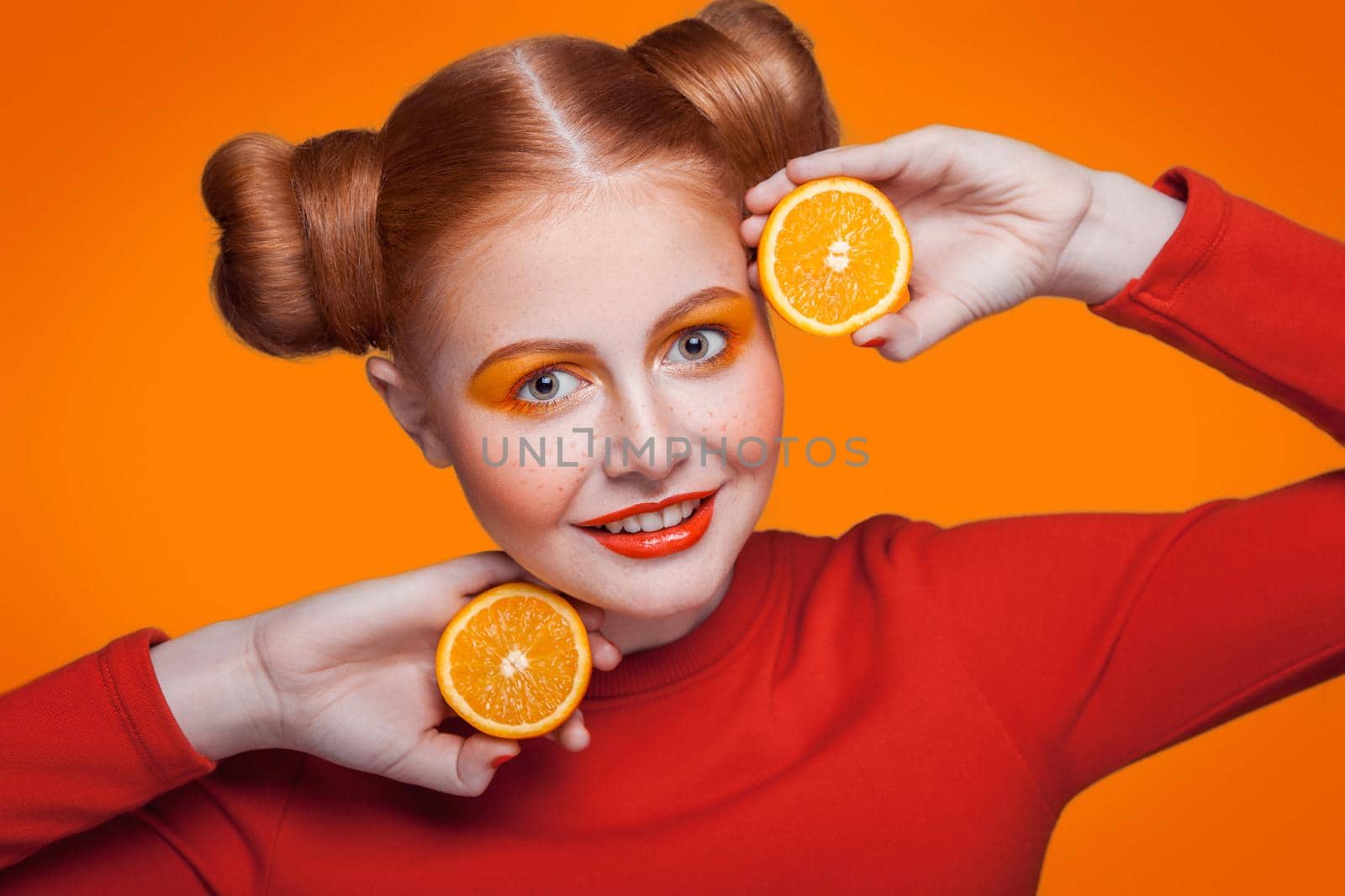Young beautiful fashion model with orange. studio shot. by Khosro1