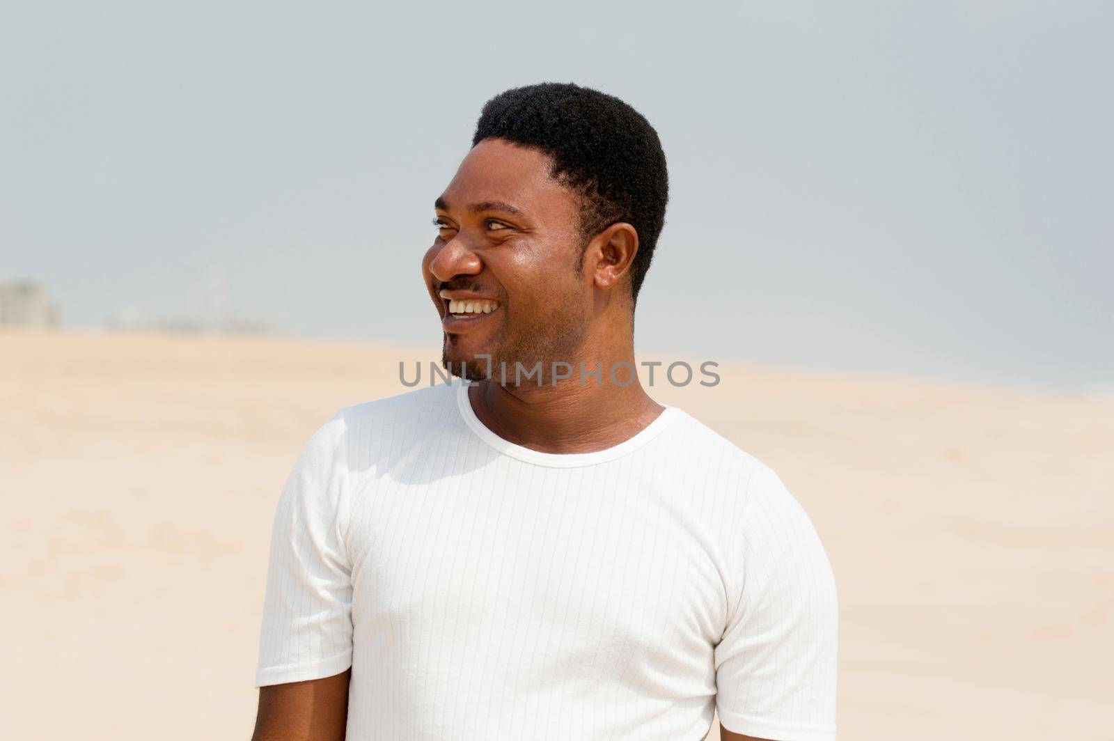 portrait of young man at the beach. by vystek