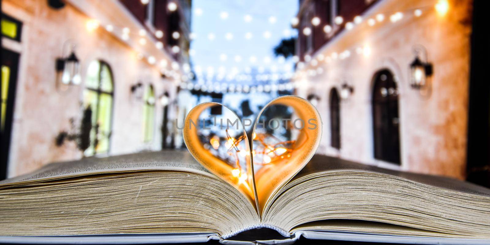 Book with love symbol isolated on cafe street background, Close-up Of Heart Shape Book , by anna_stasiia