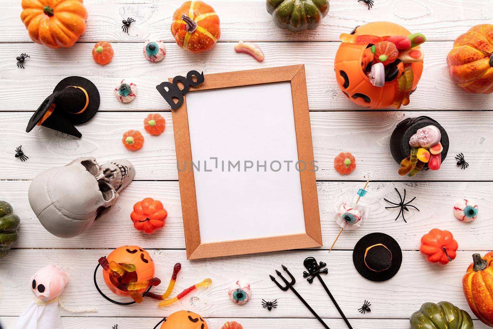 Halloween concept. Blank frame mock up design with halloween decorations and sweets