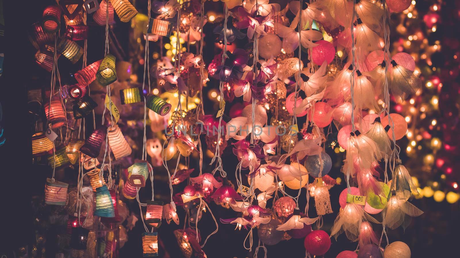 Chinese lantern festival image . Colourful Paper Lantern hanging decorate interior and exterior .outdoor Romantic idea . Christmas Eve  lights, lanterns in paper bags at night along road, street by Petrichor