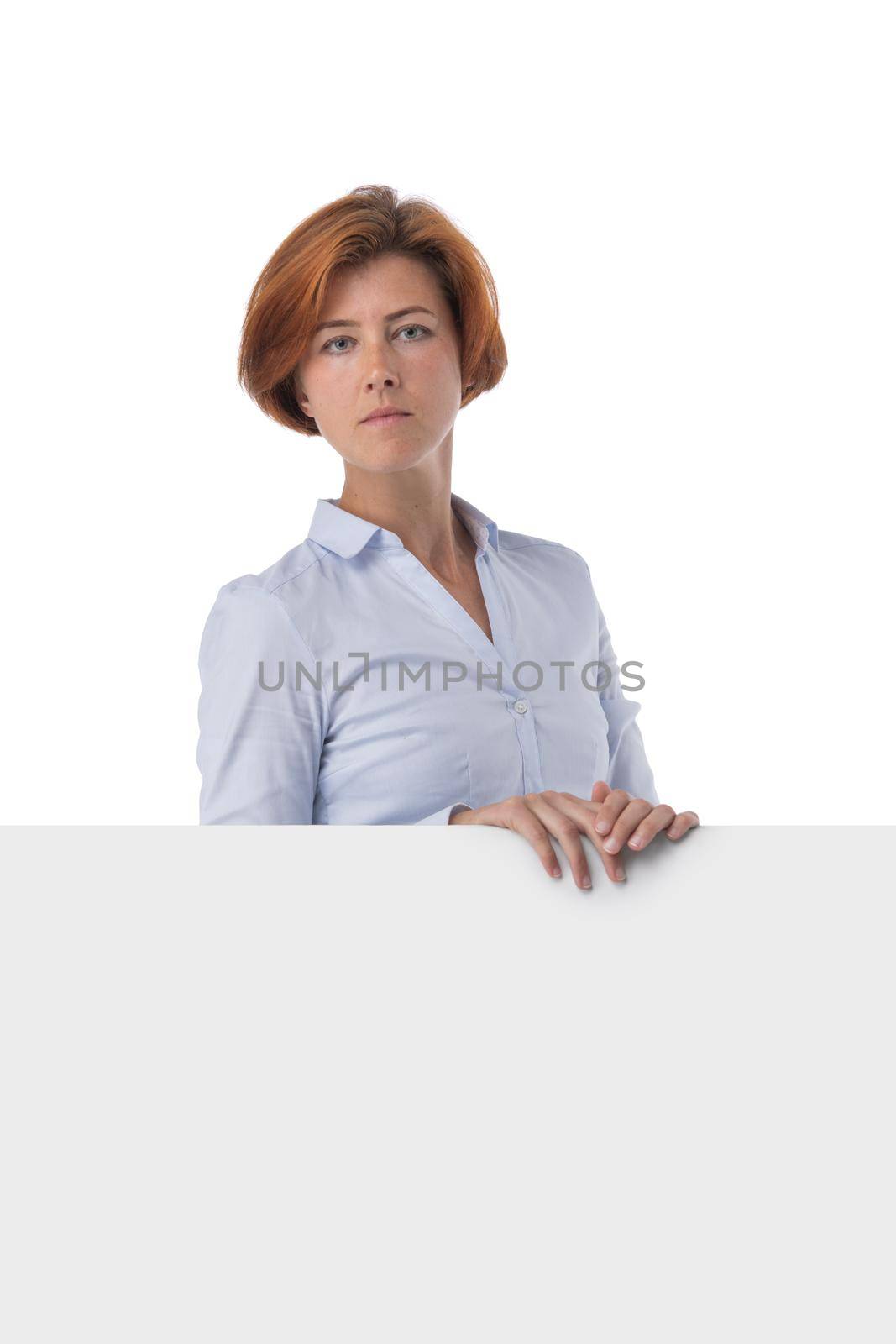 Redhead business woman holding blank sign by ALotOfPeople