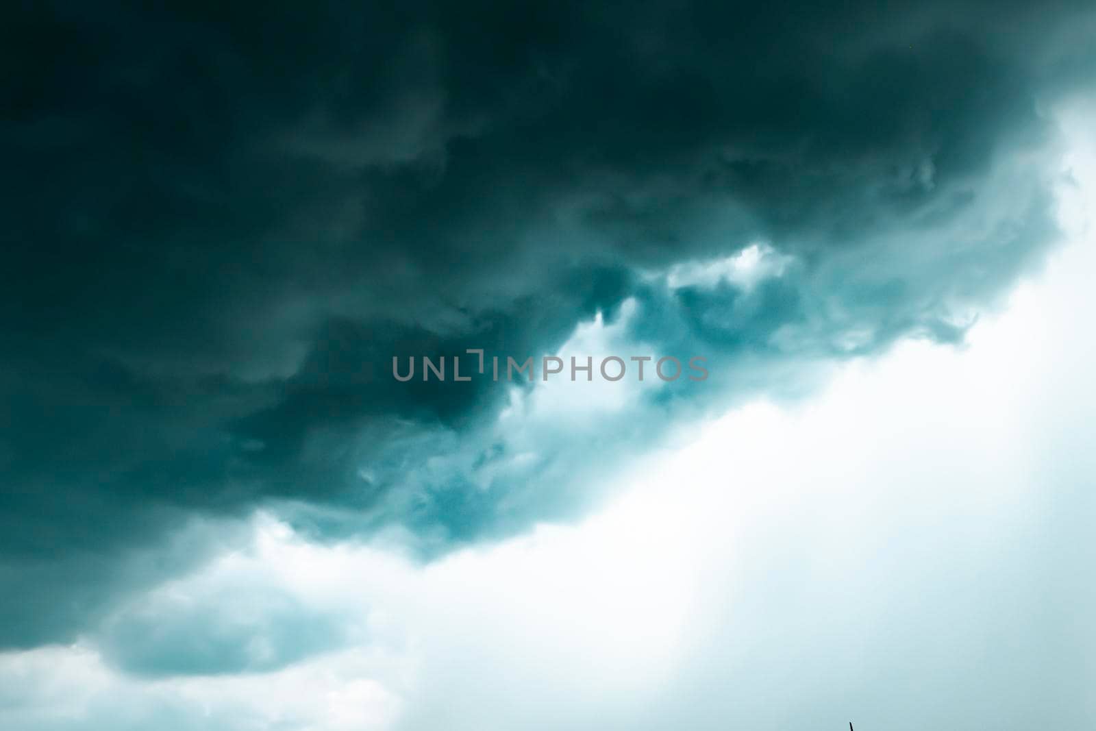 Dark sky and black clouds before rainy, Dramatic black cloud and thunderstorm .half of sky .season change by Petrichor